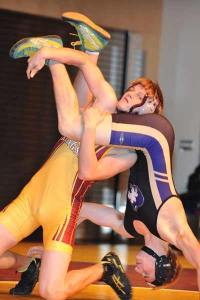 Kingston wrestler Michael Lujan gets the advantage and pin on Sequim wrestler Winsten Babb during a meet on Jan. 5.