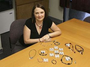 U Design Jewelry Representative Megan Howard shows off some of the pieces that can be made with U Design Jewelry. People can host home parties where they design their own jewelry.