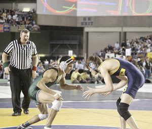 Klahowyas Karl Neumann battles Steven Schramm of Selah at Mat Classic last year. Neumann is hoping to claim Klahowyas first state title this season.