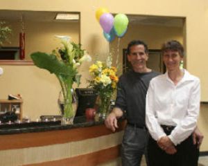 Ron and Dr. Meg Simans hosted a ribbon-cutting ceremony May 30 at their business