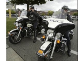 Bremerton police officers J.D. Miller (left) and Russ Holt will be on patrol catching speeders in school zones in Bremerton starting Wednesday