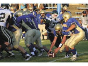 Bremerton quarterback Jacob Belden fumbles a snap during the Knights’ opening game 16-10 victory against Klahowya Sept. 5. The Knights (1-4) have since gone winless.