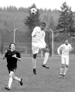 South Kitsap’s Bryan Heath goes airborne for a header against Central Kitsap.