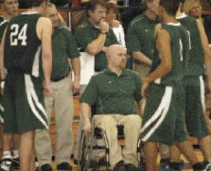 Then-KSS boys basketball coach Scott McMinds talks with his players in a district loss to Fife. McMinds will take over the boys hoops job at CK.