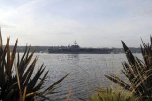 USS Kitty Hawk’s bow is shown as the ship pulls into Sinclair Inlet near Puget Sound Naval Shipyard in Bremerton Sept. 2. Bremerton is the ship’s new homeport and it will be its last