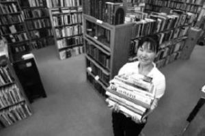 Bookstop owner Soon Hood is surrounded by hand picked collections of books at her Front Street location. The store is celebrating it’s 25th year in business.