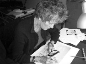 Above: Elizabeth Reed Smith at work magnifying glass in one hand