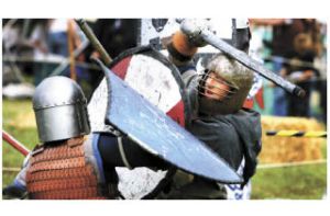 Heavy combat fighter Aephen of Eppelhurst battles during the Saturday tourney at Port Gamble. The local chapter of the Society for Creative Anachronism sponsored the annual Medieval Faire.