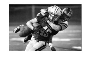 Kingston High School running back Travis Schriner takes a Washington player for a ride during a tackle attempt at Friday’s home game against Washington High School. The Bucs lost 21-14 in double overtime. Kingston hosts Sequim Friday at NK stadium.