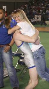 Olympics Branden Yeik lifts his sister Camie after winning the 3A 130-pound title on Saturday at the Tacoma Dome.