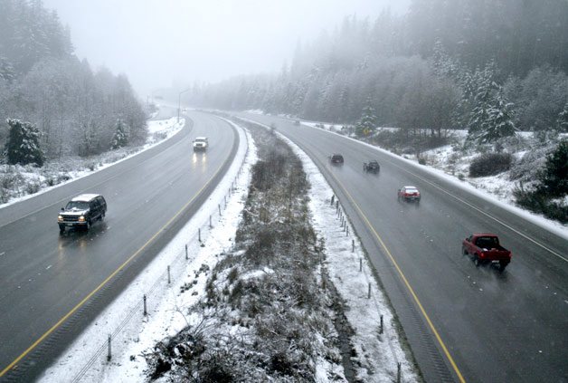 A view from the Trigger Avenue overpass in Silverdale shows slushy road conditions on State Route 3. Local law enforcement and emergency personnel were kept busy as the slippery road conditions led to accidents throughout the day. The National Weather Service calls for rain into the night.