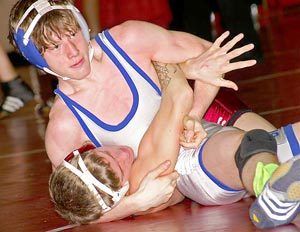Olympics Brandon Truini tries to flip Bethels Alex Acosta on his back in the championship match at 119 at the Panther Classic.