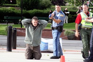 A Washington State Patrol Trooper takes one of the “suspects” into custody during last Friday’s Department of Homeland Security training exercise at Olympic College in Bremerton.