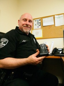 Home Monitoring Officer Don Kennedy of the Poulsbo Police Department displays an ankle bracelet. If the wearer doesn’t answer his or her cell phone