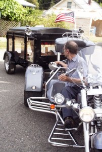 Towed by a three-wheeled Harley