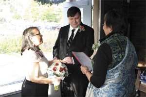 David Martinson places the ring on the finger of his bride