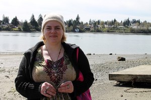 Kellie Terrebonne is searching Dyes Inlet for a lost rock.