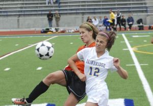 Bainbridge High School forward Celia Story collides with an unidentified Central Kitsap High School player during the Saturday Oct. 1