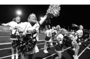 North Kitsap’s cheerleaders cheer on the Vikings in their game against the Bremerton Knights in the first quarter at homecoming on Oct. 17.