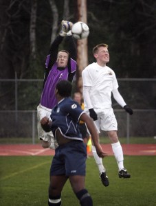 South Kitsap junior midfielder Justin Peterson vies for the ball during the Wolves’ 2-1 loss Tuesday night against Bellarmine Prep.