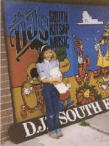 Shannon Watson poses in front of her father’s music store.