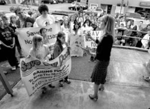 Poulsbo Mayor Kathryn Quade chats with pool advocates before the Wednesday city council meeting.