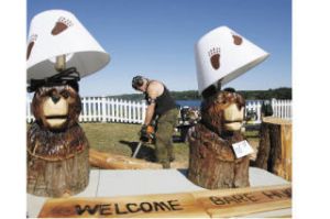 Local Suquamish chainsaw artist Marty Smith works on his next creation during a demonstration at the Port Gamble Old Mill Days Sunday. Thousands of spectators turned out for the weekend-long event which included guided forest walks