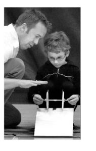 (above) Pearson Elementary student Lucas Rhodes steadies his two-wheeled vehicle under the eye of Suquamish teacher Jason Koontz during the annual Science Olympics at Kingston Middle School Thursday. (right) Breidablik fifth graders Martha Rabura