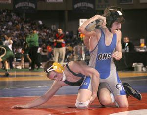 Olympics Jesse Borcherding hangs on to Billy Richardsons foot in the duos fourth meeting this season at Mat Classic.