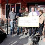 The Gavin Buchanan Memorial Foundation presented a check for $5,780.13 to the Bremerton Police Department and Kitsap County Sheriff&rsquo;s Office, to benefit the K-9 units, on Friday, Nov. 4.  Michelle Beahm / Kitsap News Group