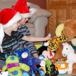 Zachary Darner, left, and Ryan Downey, right, are collecting donations of toys, stuffed animals and books to give to children who will be in the hospital over the holidays. Michelle Beahm / Kitsap News Group