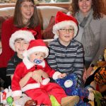 Clockwise from top left: Beth Friedman Darner, Nicole Downey, Ryan Downey, Noah Darner and Zachary Darner. Partially inspired by Noah&rsquo;s trips to the emergency room last holiday season, the group is working to collect donations of toys, books and stuffed animals for children ages 2 to 16 who will be in the hospital over the holidays.                                Michelle Beahm / Kitsap News Group