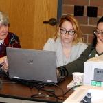 From left, Julia Stark, Josie Baxter and Hazel Simpson check a voter&rsquo;s registration so the correct ballot can be given to her, Nov. 8 at the Poulsbo Fire Department polling station. In addition to ballot drop boxes throughout the county, the county staffs a polling place in Poulsbo and in Port Orchard. (Richard Walker/Kitsap News Group)