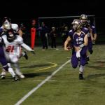 Junior QB Keenan Kakuda looks for an opening, Nov. 4 vs. Orting. (Sophie Bonomi/Kitsap News Group)