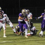Junior running back Dax Solis gains some yardage Nov. 4 vs. Orting. (Sophie Bonomi/Kitsap News Group)