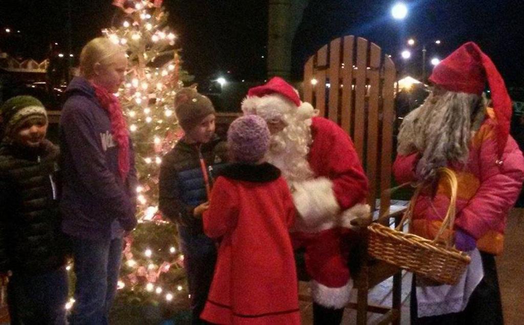 Santa Claus visits with children during the Julefest celebration, Dec. 3 at Muriel Iverson Williams Waterfront Park. (Angie Donovan/Kitsap News Group correspondent)