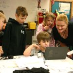 Kathryn Sprague, right, and her students update the tally of donated cereal boxes Monday, Dec. 12. The total count when they finished was 607 boxes of cereal.                                Michelle Beahm / Kitsap News Group
