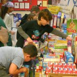 Students add boxes of cereal at the front of View Ridge Elementary. The school-wide goal for the food drive was 500 boxes, which was met Monday, Dec. 12.                                Michelle Beahm / Kitsap News Group
