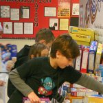 Students add boxes of cereal at the front of View Ridge Elementary. The school-wide goal for the food drive was 500 boxes, which was met Monday, Dec. 12.                                Michelle Beahm / Kitsap News Group