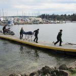 Emergency personnel transport a body recovered Dec. 8 from beneath the Illahee Bridge near Brownsville Marina. (Terryl Asla/Kitsap News Group)