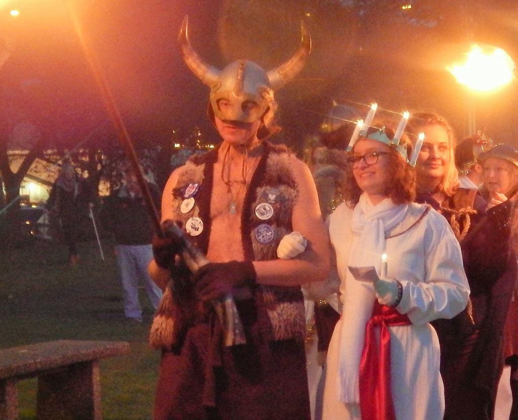 The Lucia Bride arrives with Viking escort during the Julefest celebration, Dec. 3 at Muriel Iverson Williams Waterfront Park. (Angie Donovan/Kitsap News Group correspondent)
