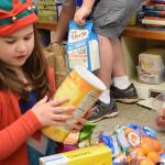 Fifth-graders from The Island School recently delivered 81 pounds of food to North Kitsap Fishline and many boxes of holiday food to Helpline House on Bainbridge Island. (Joan Henderson/Contributed)