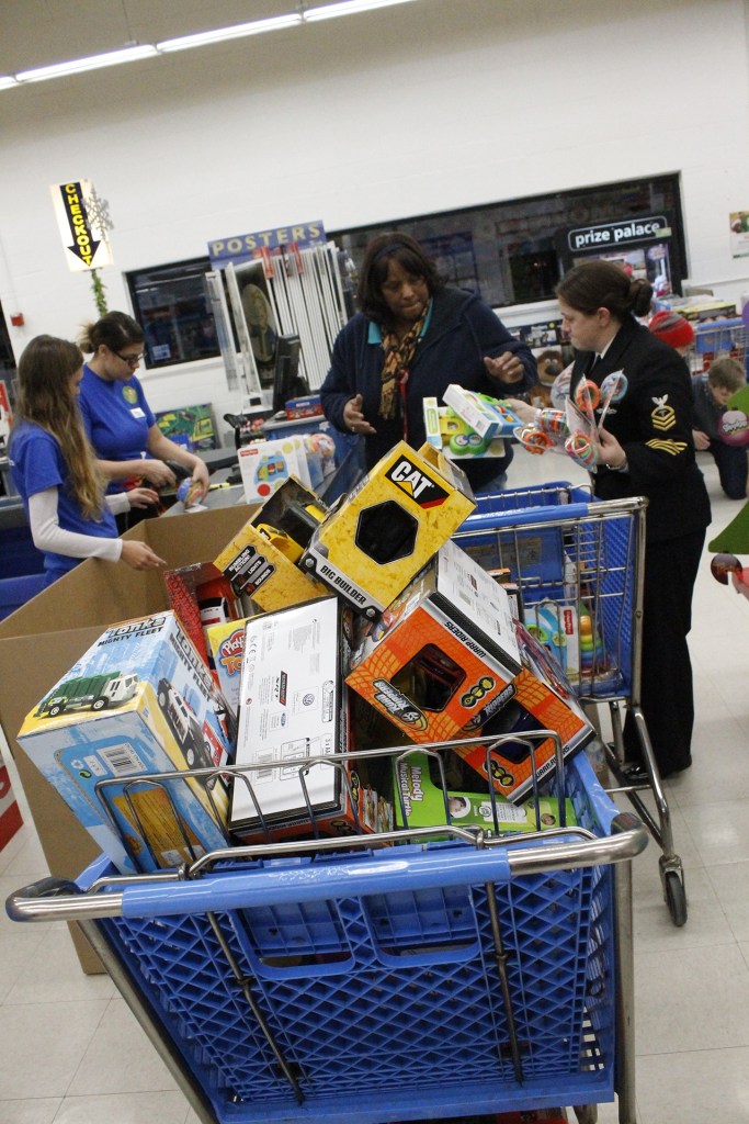 Checking out at Toys R Us. Toys R Us employees set back popular toys when they are on sale so that the Marines get &ldquo;the good stuff&rdquo; and at a great, discounted price. Mark Briant/Kitsap Daily News