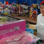 &ldquo;Thirty-two, girls, ages 6 to 8,&rdquo; calls out one of Santa&rsquo;s helpers, counting the number of toys and for whom they are intended. Terryl Asla/Kitsap Daily News