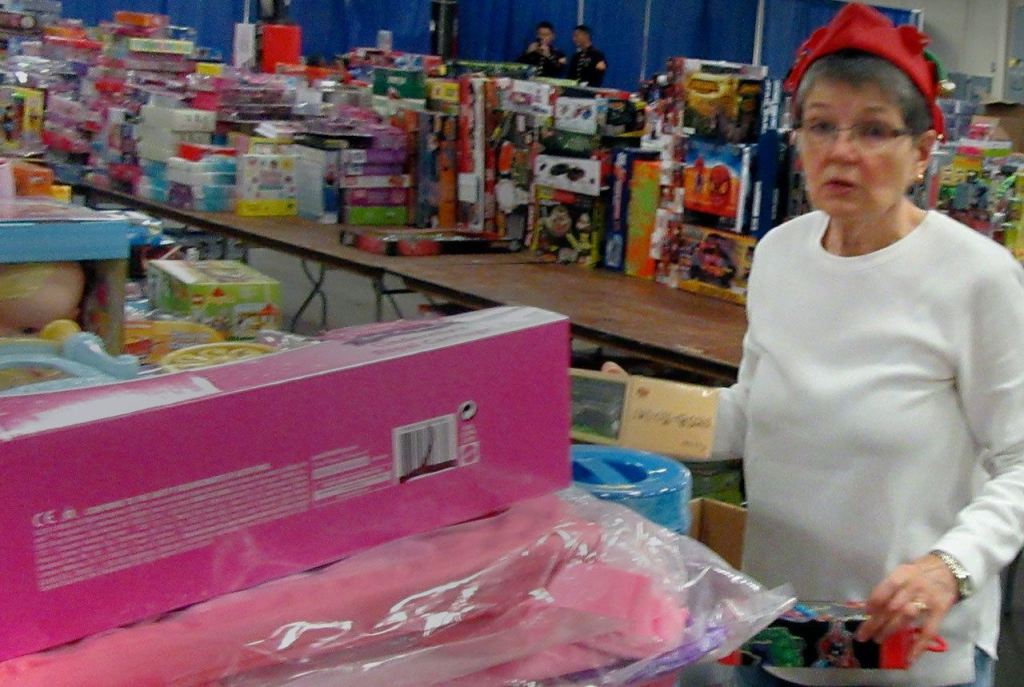 &ldquo;Thirty-two, girls, ages 6 to 8,&rdquo; calls out one of Santa&rsquo;s helpers, counting the number of toys and for whom they are intended. Terryl Asla/Kitsap Daily News