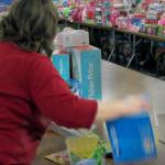 Volunteers sort and count the toys as they come in. Terryl Asla/Kitsap Daily News