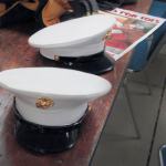 Marines in dress uniforms doff their covers and get down to work with the other volunteers from the Marine League. Terryl Asla/Kitsap Daily News