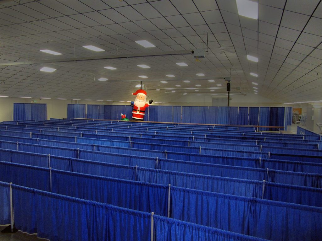 Waiting for the kids. Beginning at 10 a.m. Saturday morning, Dec. 17th, these empty aisles will fill up bright-eyed children and their grownups. In addition to their children, grownups should bring ID showing they are receiving state or federal aid and a piece of mail with the family&rsquo;s current address. Kitsap Toys for Tots serves Kitsap County and north Mason County, including Belfair and Allyn. Terryl Asla/Kitsap Daily News