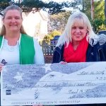 Rose Holburn of the Port Orchard Eagles presents a ceremonial check of $3,500 to South Kitsap Helpline&rsquo;s Jennifer Hardison for the agency&rsquo;s Christmas meal and new toy program.                                South Kitsap Helpline photo