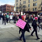 Along the route, marchers often heard support from spectators watching through their windows. Sara Bernard / Sound Publishing